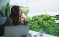 A young businesswoman enjoy listening to music to relieve stressed at work