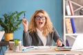 Beautiful young businesswoman having idea in office Royalty Free Stock Photo