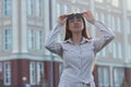 Beautiful young businesswoman standing in the city street Royalty Free Stock Photo