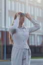 Beautiful young businesswoman standing in the city street Royalty Free Stock Photo