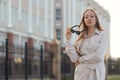 Beautiful young businesswoman standing in the city street Royalty Free Stock Photo