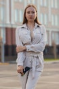 Beautiful young businesswoman standing in the city street Royalty Free Stock Photo