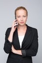 Beautiful young caucasian businesswoman talking on mobile phone. Royalty Free Stock Photo