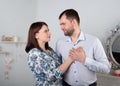 Beautiful young caucasian couple at home. Hugging, kissing and having fun together. Happy family Royalty Free Stock Photo