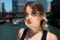 Beautiful Young Caucasian Girl with Barbell septum Nose Ring Horseshoe Nose Ring in Windy City at a sunny day.