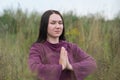 Beautiful young girl meditating in autumn park Royalty Free Stock Photo