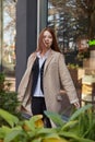 outdoors portrait of young caucasian red headed girl in coat with long hair Royalty Free Stock Photo