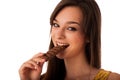 Beautiful young caucasian woman eating chocolate Royalty Free Stock Photo