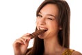 Beautiful young caucasian woman eating chocolate Royalty Free Stock Photo