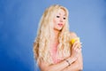 Beautiful blonde woman  light blue background Royalty Free Stock Photo