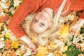 Woman lying down on yellow leaves Royalty Free Stock Photo