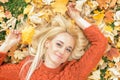 Woman lying down on yellow leaves Royalty Free Stock Photo