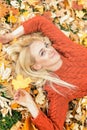 Woman lying down on yellow leaves Royalty Free Stock Photo