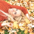 Woman lying down on yellow leaves Royalty Free Stock Photo