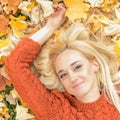 Woman lying down on yellow leaves Royalty Free Stock Photo