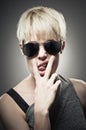 Beautiful Young Caucasian Woman Wearing Aviator And Making A Rude Gesture Royalty Free Stock Photo