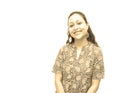 Beautiful young and charming Indian Lady smiling in white background in monochrome sepia tone.