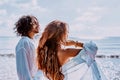 Beautiful young cheerful couple on the beach