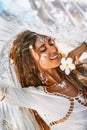 Beautiful young cheerful woman portrait with frangipani flower