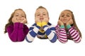 Beautiful young children wearing pajamas leaning on their elbows Royalty Free Stock Photo