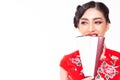 Beautiful young Chinese woman look at copy space. Attractive young asian female wear Chinese dress, holding Chinese hand fan in Ch Royalty Free Stock Photo