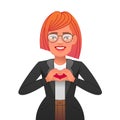 A beautiful young confident woman in glasses folds her palms in the shape of a heart. Stylish happy girl in a business suit with Royalty Free Stock Photo