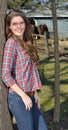 Beautiful young country girl on farm Royalty Free Stock Photo