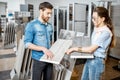 Couple choosing ceramic tiles in the shop Royalty Free Stock Photo