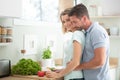 beautiful young couple cooking dinner