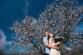 Beautiful young couple dancing and having fun on blue sky background Royalty Free Stock Photo