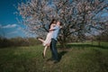 Beautiful young couple dancing and having fun on blue sky background Royalty Free Stock Photo