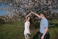 Beautiful young couple dancing and having fun on blue sky background Royalty Free Stock Photo