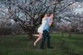 Beautiful young couple dancing and having fun on blue sky background Royalty Free Stock Photo