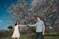 Beautiful young couple dancing and having fun on blue sky background Royalty Free Stock Photo