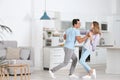 Beautiful young couple dancing in kitchen Royalty Free Stock Photo