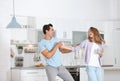 Beautiful young couple dancing in kitchen Royalty Free Stock Photo