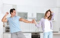 Beautiful young couple dancing in kitchen Royalty Free Stock Photo