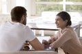 Beautiful young couple drink tea, enjoy talk in cafeteria Royalty Free Stock Photo