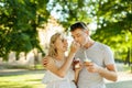 Beautiful young couple eating ice-cream on the street Royalty Free Stock Photo