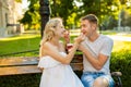 Beautiful young couple eating ice-cream on the street Royalty Free Stock Photo