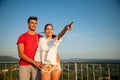 Beautiful young couple enjoing nice view over countryside