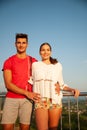 Beautiful young couple enjoing nice view over countryside