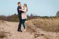 Beautiful young couple enjoying spring beach vacation, playful on sunny blue sky outdoors.having fun and being active Royalty Free Stock Photo