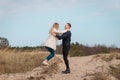 Beautiful young couple enjoying spring beach vacation, playful on sunny blue sky outdoors.having fun and being active Royalty Free Stock Photo