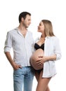 Beautiful young couple expecting baby. A happy family. Isolation on a white background. Pregnancy, childbirth.