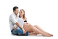 Beautiful young couple expecting baby. A happy family. Isolation on a white background. Pregnancy, childbirth.