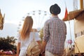 Beautiful, young couple having fun at an amusement park. Couple Dating Relaxation Love Theme Park Concept. Couple posing together Royalty Free Stock Photo