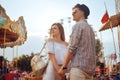 Beautiful, young couple having fun at an amusement park. Couple Dating Relaxation Love Theme Park Concept. Couple posing together Royalty Free Stock Photo