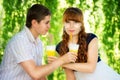 Beautiful Young Couple Having Fun. Picnic in Countryside. Happy Royalty Free Stock Photo