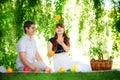 Beautiful Young Couple Having Fun. Picnic in Countryside. Happy Royalty Free Stock Photo